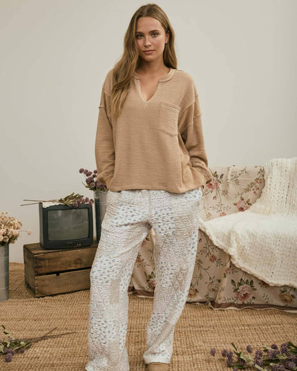 SPLIT NECK RAW EDGE LONG SLEEVE RIBBED KNIT TOP