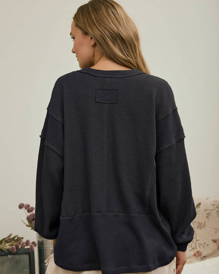 SPLIT NECK RAW EDGE LONG SLEEVE RIBBED KNIT TOP