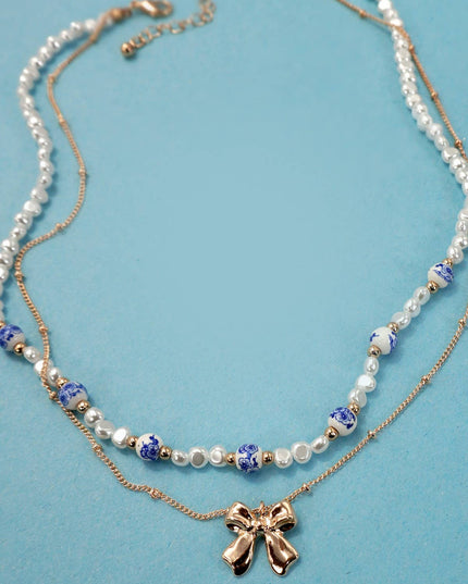 CERAMIC PORCELAIN PEARL BOW LAYER NECKLACE | 80N91555