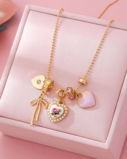 Multi Charm Porcelain Bow Ball Chain Necklace | 80N92892