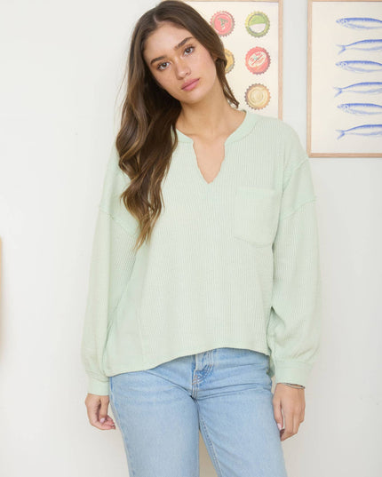 SPLIT NECK RAW EDGE LONG SLEEVE RIBBED KNIT TOP