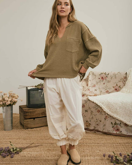 SPLIT NECK RAW EDGE LONG SLEEVE RIBBED KNIT TOP