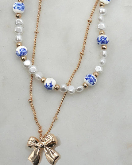 CERAMIC PORCELAIN PEARL BOW LAYER NECKLACE | 80N91555